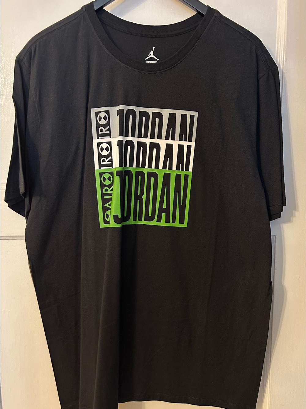Jordan Black Short Sleeve Tee with White and Green Logo Blocks